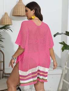 Detail of colorful striped hem and pink crochet texture on a beach cover-up dress