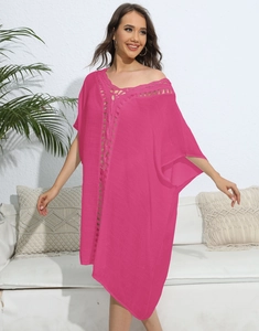 Detail of rose pink beach cover-up with crochet lace neck and bohemian loose sleeves