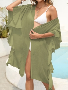 Detail of ruffle hem on women's olive green beach cardigan cover up for summer