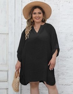 Detail of V-neckline and textured fabric on black plus-size beach kaftan dress