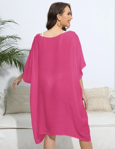 Back view of a loose rose red beach kaftan cover-up showing draped fabric and fit