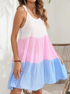 Detailed view of color block tiered sun dress with white pink and blue stripes