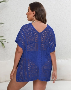 Macro view of blue crochet bikini cover-up showing geometric hollow patterns and side slit