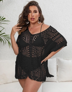Detail of black crochet hollow-out knit beach cover-up with V-neck and batwing sleeves