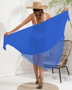 Detail of royal blue chiffon beach sarong featuring fringe tassels and mesh hemline