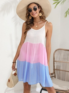 Detail of multi-colored tiered beach dress with v-neck and striped stitching design