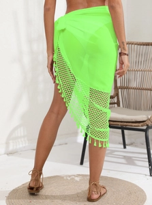 Detail view of neon green mesh beach sarong featuring fringe trim and waist tie design