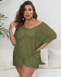 Detail of army green hollow crochet beach dress with V-neck and geometric knit pattern