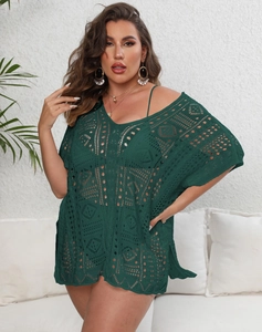 Detail of deep green hollow crochet beach cover-up featuring geometric knit patterns