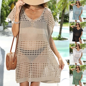 Detailed close-up showing the intricate knit pattern and V-neck of this beach cover-up dress