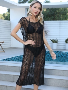 Detailed macro view of the black crochet beach cover-up with hollow knit wave textures