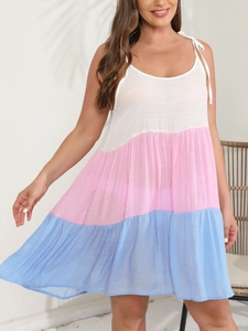 Detail of multi-tier color block sundress with tie-up straps and tiered skirt