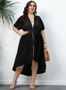 Macro shot of plus-size black chiffon cardigan with swiss dot texture and tie waist detail