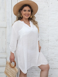 Detail of white V-neck beach cover-up featuring high-quality cotton texture and side slits