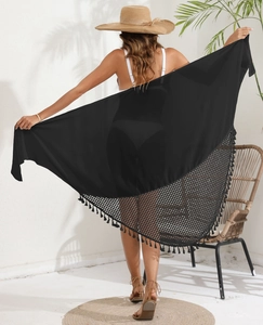 Detail of black chiffon sarong featuring mesh panel stitching and fringe tassel hemline