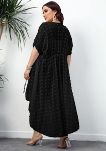 Detail view of black chiffon cardigan featuring 3D polka dot texture and loose fit
