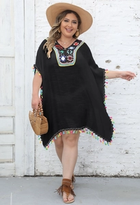 Detail showing colorful crochet embroidery neckline and fringes on black plus size beach coverup