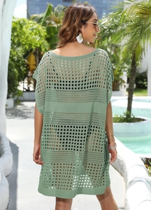 Sage green crochet beach cover-up featuring open-knit patterns and a relaxed loose fit
