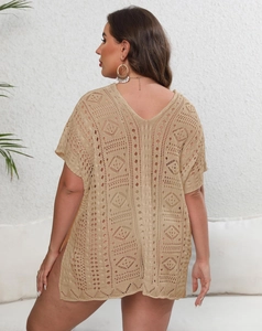 Detail of khaki crochet beach cover-up featuring geometric hollow patterns and side slits