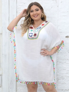 White boho beach kaftan featuring colorful crochet neckline and vibrant tassel trim details