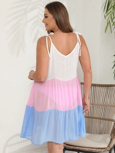 Back view of a tiered color-block sun dress with cute bow-tie shoulder straps