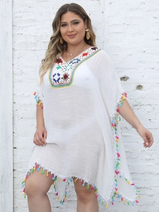 White boho beach cover-up dress with V-neck crochet floral details and colorful tassels