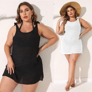 Detail of plus size beach cover-up with tie-shoulder straps in black and white colors