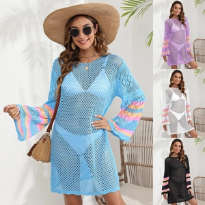 Detailed view of crochet beach cover-up with bell sleeves and colorful striped cuffs