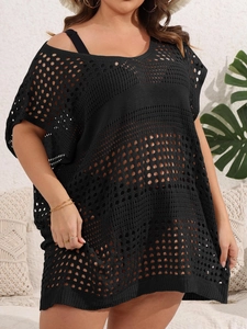 Detailed close-up of the black openwork knit crochet pattern on this beach cover-up dress
