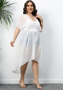 Detailed texture of white polka dot chiffon fabric on a tied irregular beach cover-up