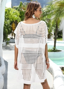 Detailed back view of white crochet beach cover-up with hollow knit texture and loose fit