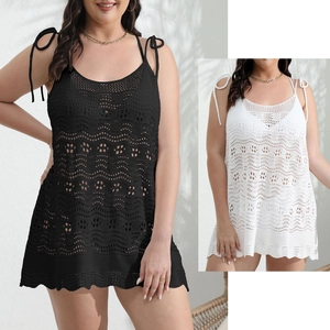 Detail of crochet knit beach dress with hollow wave pattern and adjustable shoulder straps