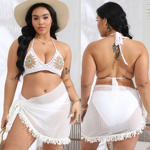 Detailed crochet bikini set with sunflower embroidery and a white polka dot sarong