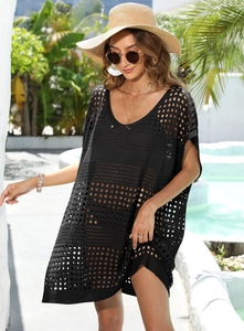 Detail view of black crochet hollow-out knit beach cover-up with V-neckline texture