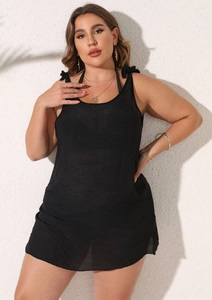 Detail of black semi-transparent beach cover-up with stylish shoulder knot design