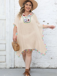 Beige bohemian kaftan dress with colorful crochet V-neck and playful fringed hem