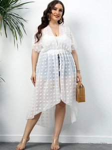 White polka dot mesh cover-up featuring a waist tie and asymmetrical hemline