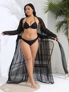 Detail view of long black sheer mesh cover-up with tie front and bikini set