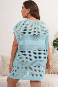 Detail view of light blue hollow crochet knit cover-up showing mesh texture and loose fit