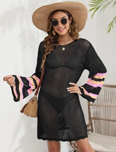 Detail of crochet cover-up dress featuring flared sleeves with pink and orange stripes