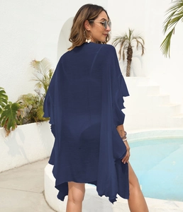 Detail of navy blue ruffled beach cover up cardigan with lightweight crepe fabric texture