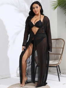 Detail of sheer black long mesh cover-up with front tie and elegant see-through sleeves