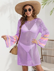 Detail of purple crochet beach cover-up with striped flare sleeves and hollow-out texture