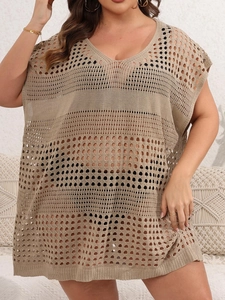 Close-up of khaki crochet hollow-out beach tunic with geometric knit mesh texture