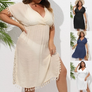 Detail view of V-neck beach cover-up with white tassel trim in multiple summer colors