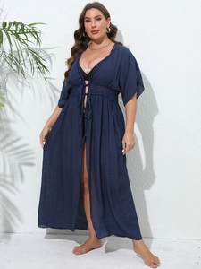 Detail of the navy blue lace crochet waist and drawstring closure on this beach cover up
