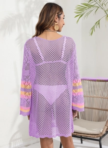 Back view of a purple crochet beach cover-up with striped cuffs and hollow knit texture
