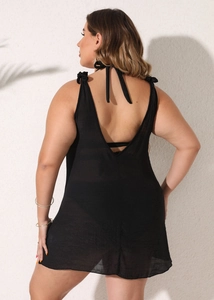 Detail of plus size black beach cover-up featuring backless V-neck and shoulder ribbon ties