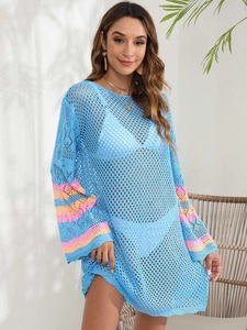 Detail of blue crochet knit beach cover-up with orange and pink striped flared sleeves