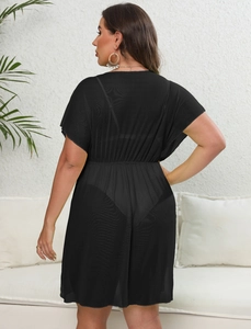 Detail of plus size black mesh cover-up featuring elastic waist and sheer textured fabric